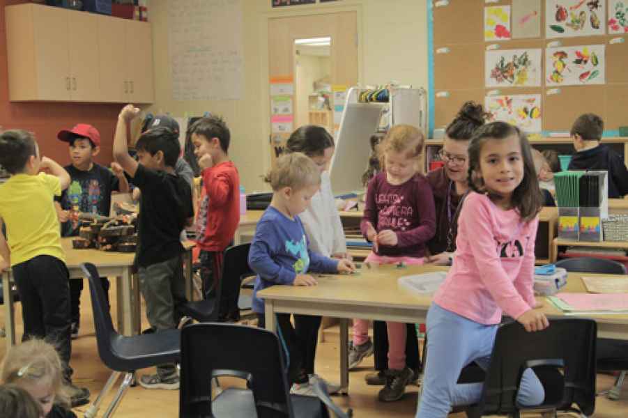 lots of children busy at play in the classroom